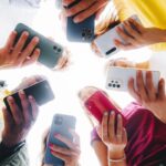 teenagers on their phones using social media